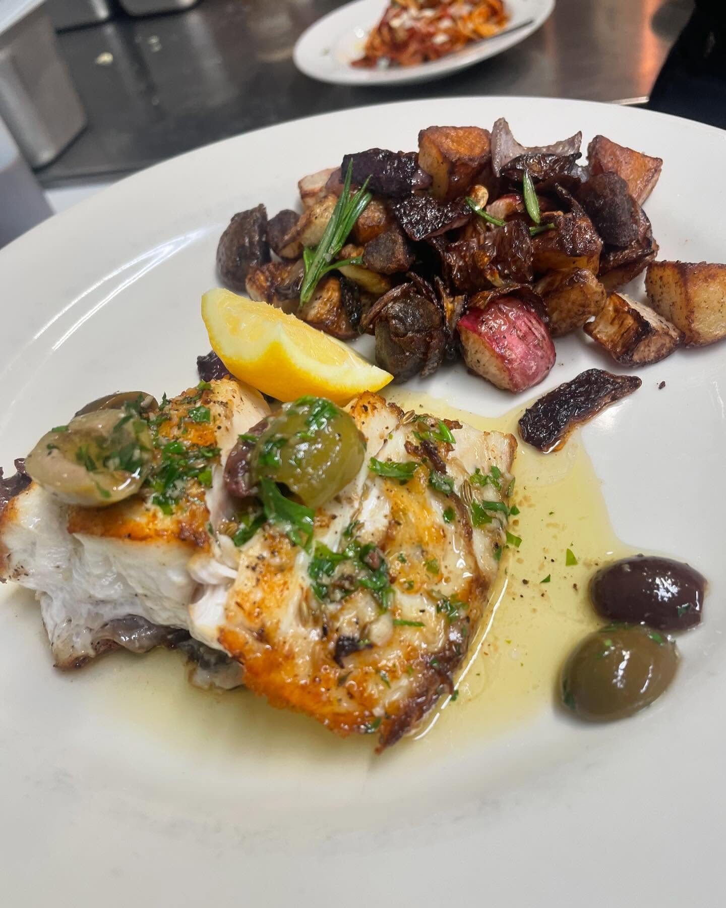 Fresh fish with roasted vegetables and olives